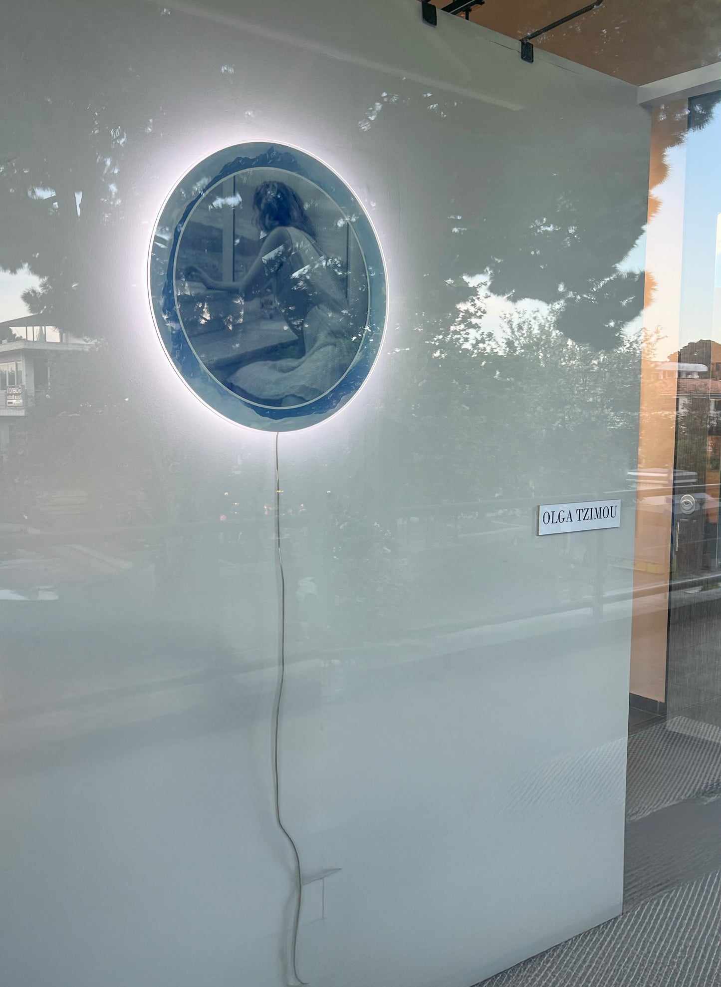 Round print on acrylic with perimeter glow lighting